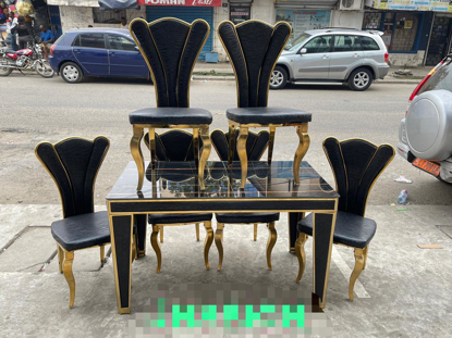 Agrandir l'image de salle a manger demontable vitrer + 6 chaises en cuir noires et doré d'or Image de salle a manger demontable vitrer + 6 chaises en cuir noires et doré d'or
