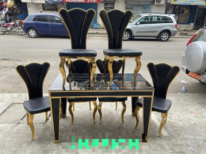 Agrandir l'image de salle a manger demontable mabrer + 6 chaises en cuir noires et doré d'or Image de salle a manger demontable mabrer + 6 chaises en cuir noires et doré d'or