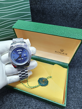 Agrandir l'image de Montre Rolex pour femme en Acier Inoxydable, dans son carton, Produit générique Image de Montre Rolex pour femme en Acier Inoxydable, dans son carton, Produit générique