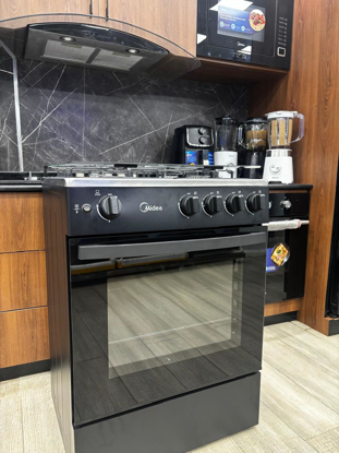 Agrandir l'image de CUISINIERE A GAZ MIDEA MD-608 NOIR - 4 FEUX - FOUR INTEGRE - GARANTIE 6 MOIS Image de CUISINIERE A GAZ MIDEA MD-608 NOIR - 4 FEUX - FOUR INTEGRE - GARANTIE 6 MOIS